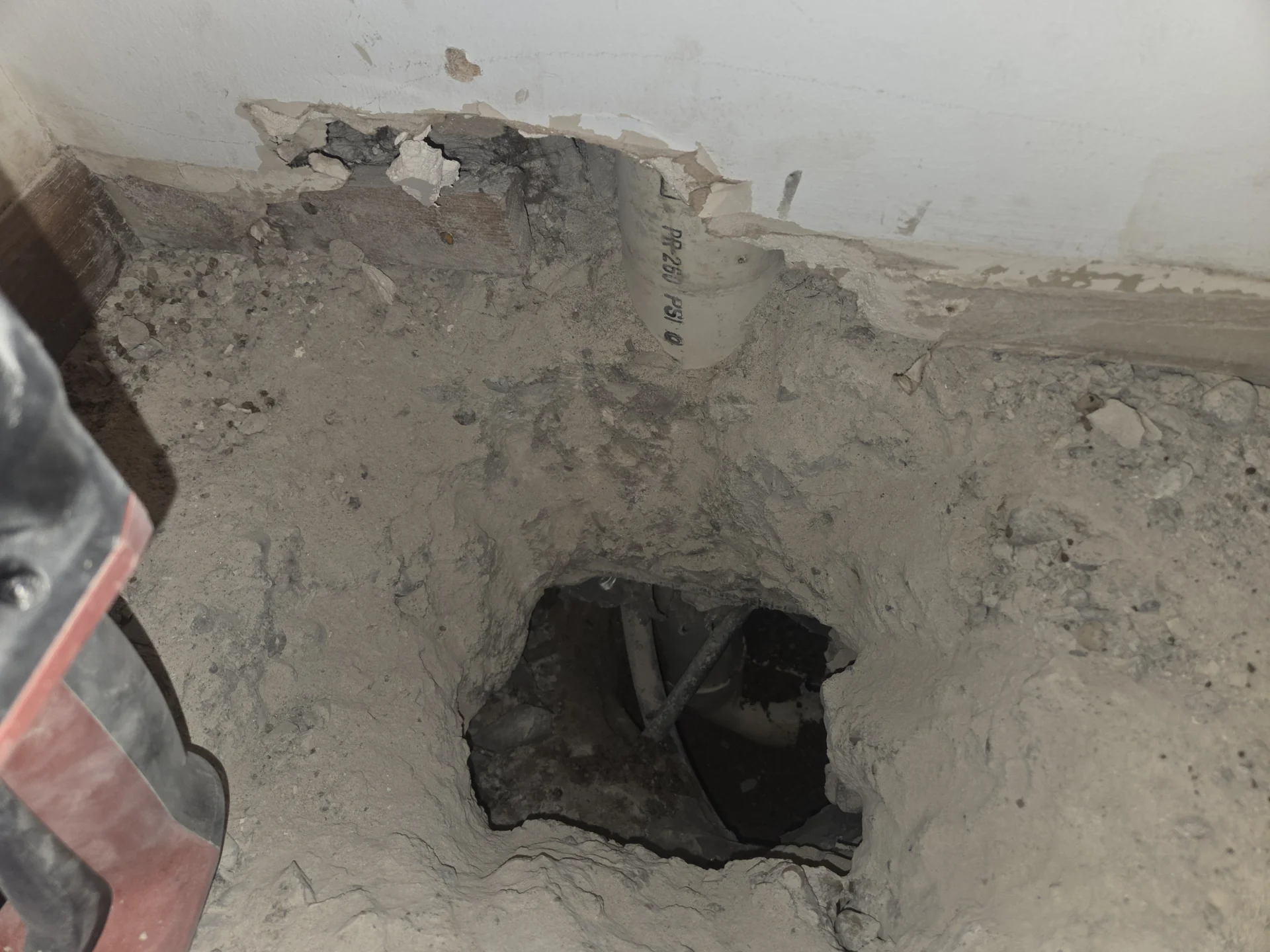 PVC drain line repair during an interior excavation
